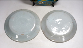 A pair of French revolution commemorative faience dishes and an 18th century Sevres plate, with later decoration, largest 23cm in diameter